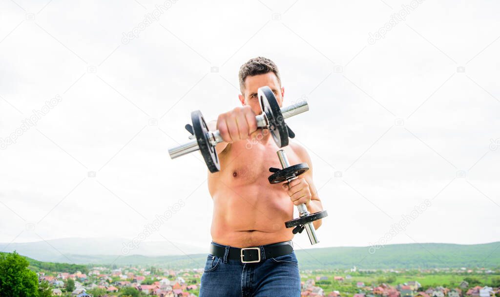 You can do it Muscular man exercising in morning with barbell. fitness and sport equipment. man sportsman with strong hands. steroids. athletic body. Dumbbell gym. success. Perfect biceps