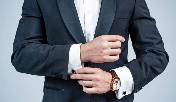 Cropped man with wristlet watch on male arm wrist in formal fashion tuxedo, fashion accessory — Stock Photo, Image