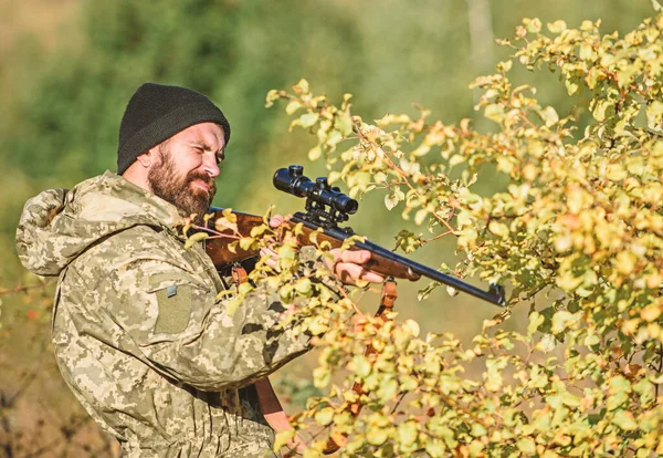 Bearded man hunter. Military uniform fashion. Army forces. Camouflage. Hunting skills and weapon equipment. How turn hunting into hobby. Man hunter with rifle gun. Boot camp. Military service