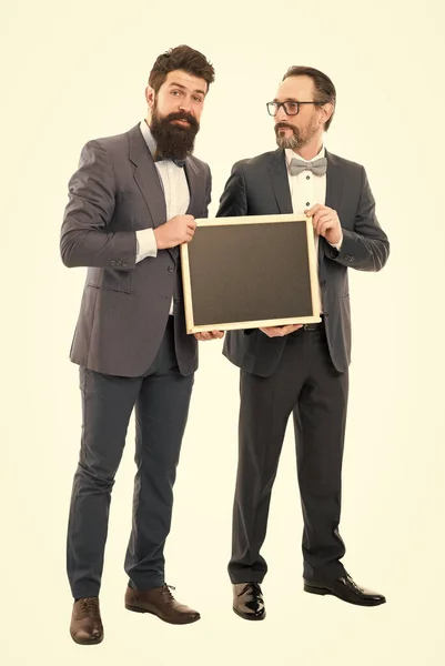 Welcome on board. bearded men hold advertisement blackboard. partners celebrate start up business isolated on white. businessmen in formal suit, copy space. announcement. Going over business details — Stock Photo, Image