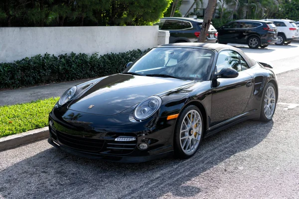 Palm Beach, Florida USA - March 21, 2021: black Porsche 911 cabriolet luxury car. left corner view. — Stock Photo, Image