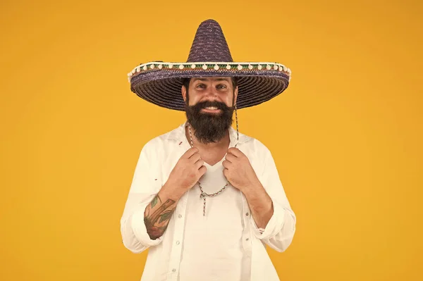 Explore heritage on your paternal line. Gain insight into ancestral origins. Mexican origins tradition. Ethnic origins. Customs and culture. Guy cheerful festive mood at party. Man in mexican hat — Stock Photo, Image