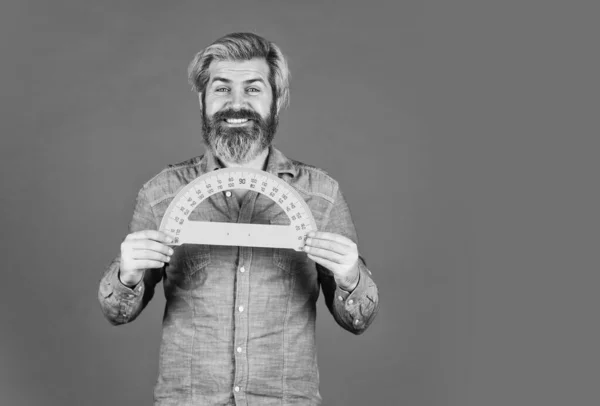 man teacher use protractor tool. bearded tutor man with ruler. draw and measure. back to school. favorite subject and disciplines. Education at school. home learning concept. copy space
