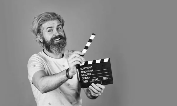 Film director concept. catch the feeling. Professional Actor Ready for Shoot. ready to film new scene. man with movie clapper. bearded guy with film making clapperboard. movie time. copy space