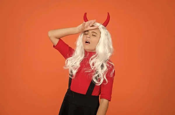 Sick and tired. tired kid has long white hair wig. childhood happiness. teen girl ready to celebrate costume party. funny red imp horns. devil costume. happy halloween. child in devil horns — Stock Photo, Image