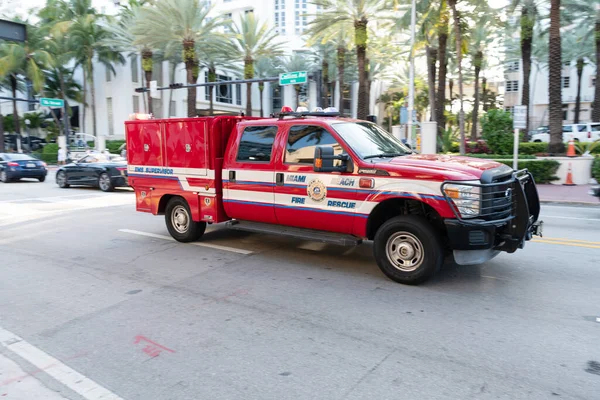 Miami Beach, Florida USA - April 15, 2021: red ford fire rescue truck in miami beach side view. 911 — Fotografia de Stock