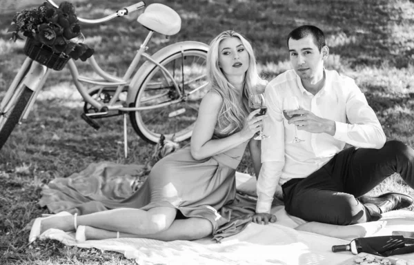 True love. Cute couple drinking wine. Romance concept. Toast. Celebrate anniversary. Attractive Couple Enjoying Romantic Sunset Picnic in Countryside. Couple drinking wine sunny day. Together forever