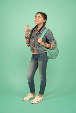 One can dream. Superstitious child make wish blue background. Keeping fingers crossed for luck. Superstition and irrational belief. Faith in magic or chance. May all the dreams come true