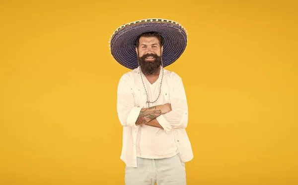 Man in mexican sombrero hat. vacation concept at resort in mexico. hipster with beard looks festive in sombrero. happy brutal male celebrating fiesta. guy wear poncho. sombrero party man — Stock Photo, Image