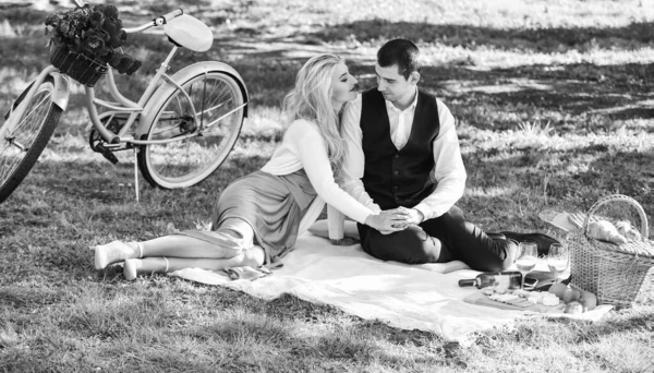 Happy together. Anniversary concept. My darling. Idyllic moment. Man and woman in love. Picnic time. Spring date. Playful couple having picnic in park. Romantic picnic. Couple cuddling on blanket — Stock Photo, Image