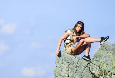 Travel Lifestyle. extremely free. alpinism lifestyle. way to success. mountain traveling and hiking. rock climbing. mountaineering lover. reaching the top. woman relax on mountain cliff. feel freedom