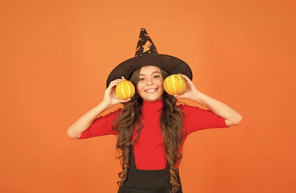 Happy celebration. teen girl has long hair wear dress for party celebration. autumn season holiday. childhood leisure. jack o lantern. happy halloween. kid wear witch hat. child with small pumpkin — Stock Photo, Image