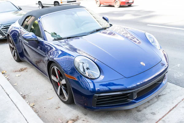 Long Beach, California USA - April 11, 2021: blue Porsche 911 Carrera cabriolet car. left side view. — Fotografia de Stock