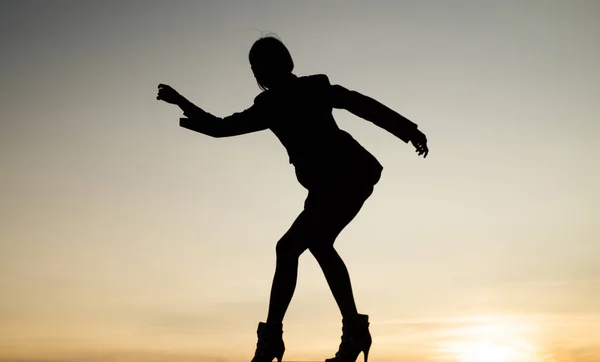 Express yourself. Woman silhouette on evening sky. Woman ballet dancer. Dancing silhouette — Stockfoto
