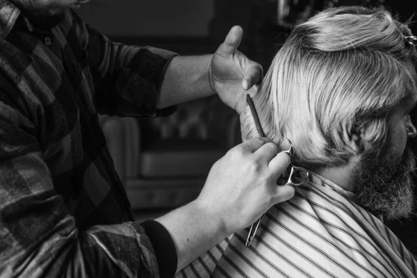 Cut hair. Barber making hairstyle for bearded man barbershop background. Guy with long dyed blond hair close up rear view. Hipster client getting haircut. Barber scissors. Manage your expectations