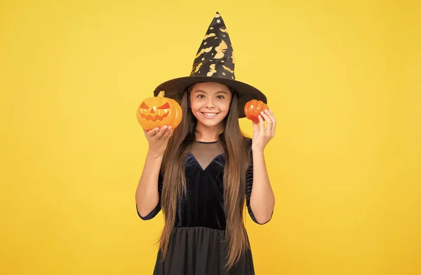 Happy halloween. child in witch hat. kid hold spooky pumpkin. witchcraft and enchantment. childhood autumn holiday. teen girl ready to celebrate. costume party fun. jack o lantern. Spooky Good Time — Stock Photo, Image