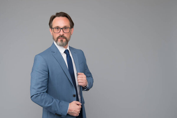 portrait of mature man wearing glasses. adult financial director in suit. best business trainer. skilled bank worker. professional in business. bearded man after hairdresser. copy space