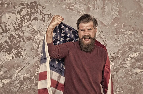 American hipster man celebrate independence day with national flag, motivating speaker concept