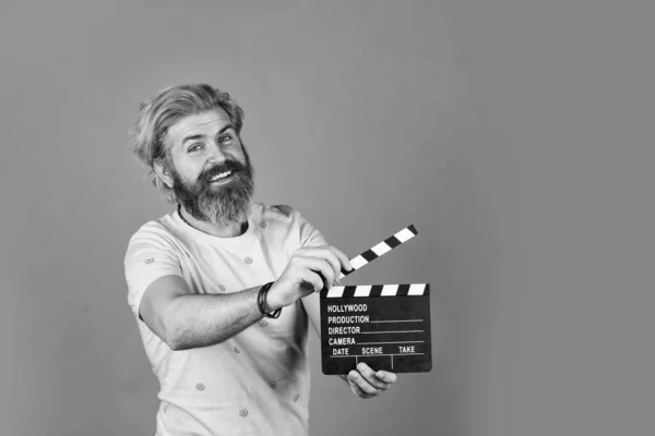 Professional male actor ready for shooting film. prepares for new scene. producer holding movie clapperboard. action. hipster man with movie clapper. Man holding film clapper. copy space