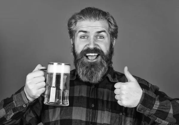 Refresh your spirit. Modern hipster getting drunk. Welcome drink. Brutal bearded man drink beer. Beer pub. Bartender bar. Man hold mug of beer. Hipster at bar counter. Having fun. Alcohol beverage