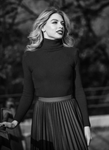 Fashionable clothes. Woman walk in autumn park. Cozy knitwear. Knitted sweater. Girl gorgeous blonde. Femininity and tenderness. Autumn stylish outfit. Fall fashion. Adorable lady enjoy sunny autumn