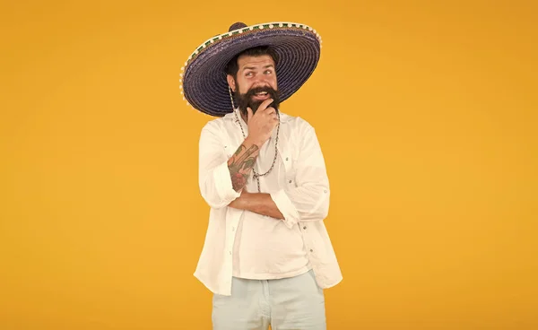 having fun on mexican party. mature bearded hipster in sombrero. summer holiday and vacation. happy mexican man wearing traditional fashion accessory. mexican energetic temper