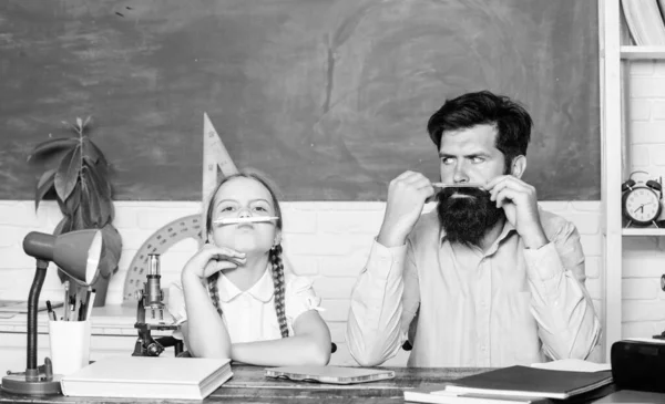 Excited about knowledge. father and daughter study in classroom. education and knowledge. bearded man teacher with small girl in classroom. back to school. math geometry. biology chemistry lesson — Stock Photo, Image