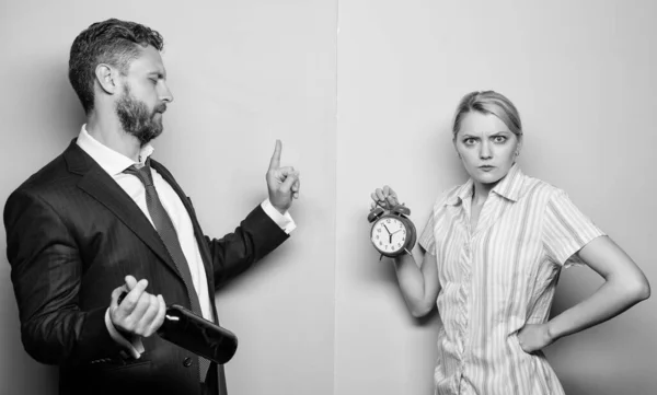 Angry wife. family psychology. unhappy life. man alcoholic drink wine. woman show time on alarm clock. wife wondering why husband reveler came home so late. family routine. problems in relationship — Stock Photo, Image