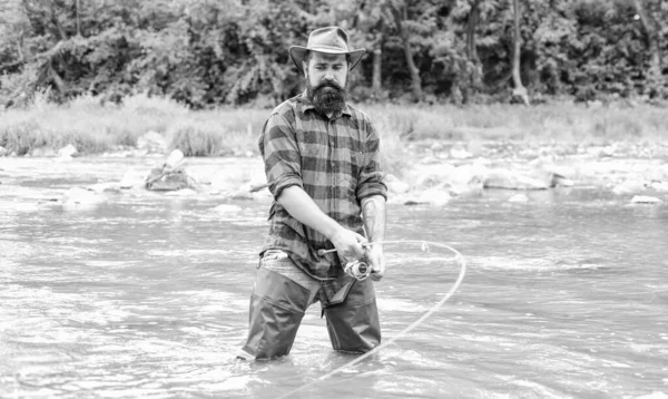 Time For A New Adventure. fisherman with fishing rod. summer weekend. Big game fishing. hobby and sport activity. pothunter. mature man fly fishing. man catching fish. bearded fisher in water — Stock Photo, Image