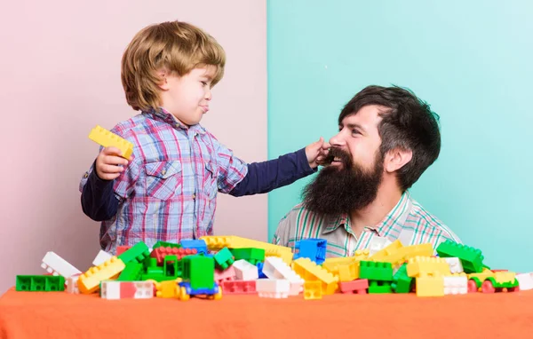 Child development. father and son play game. happy family. leisure time. little boy with bearded man dad playing together. building home with colorful constructor. love to play game. play game time — Stock Photo, Image