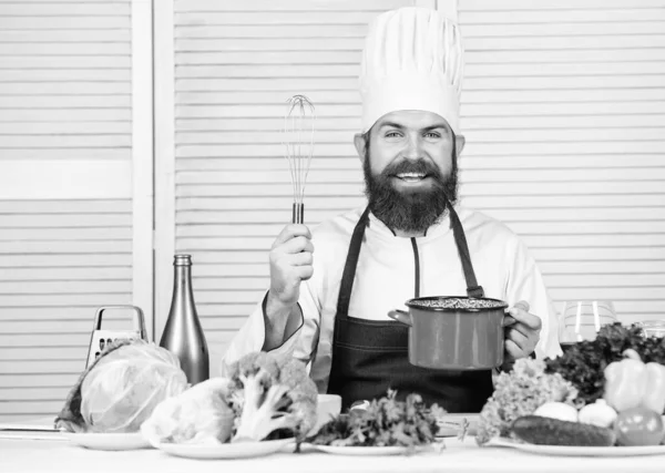 Happy bearded man. chef recipe. Dieting organic food. Vegetarian salad with fresh vegetables. Cuisine culinary. Vitamin. Healthy food cooking. Mature hipster with beard. Nice taste