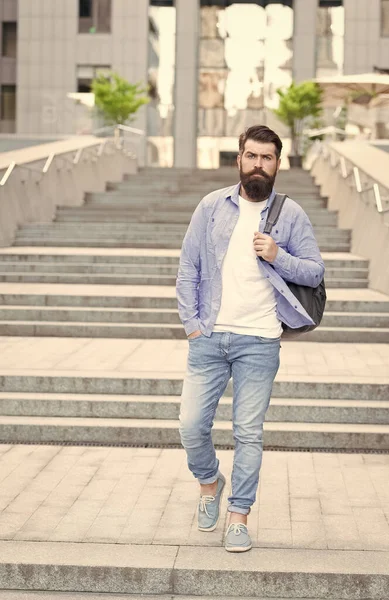 Summer is in. Bearded man go downstairs outdoors. Hipster wear fashion summer style. Casual summer outfit. Urban lifestyle. Trendy wardrobe for men. Stylish trend. Summer vacation. Wanderlust — Stock Photo, Image