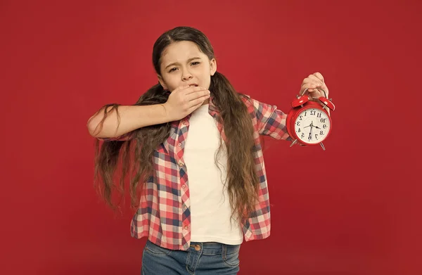 Feel so tired. alarm clock. time for holiday. time for school shopping. happy childhood. countdown to christmas or new year. child listening alarm ring. sleepy teen girl with vintage clock — Stock Photo, Image