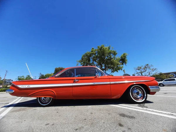 Los Angeles, California USA - March 28, 2021: red chevrolet impala retro car right side view — Stock Photo, Image
