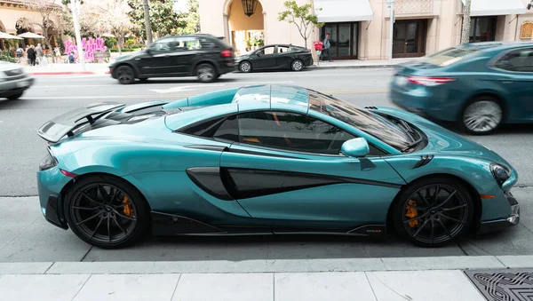 Los Angeles, California USA - April 11, 2021: turquoise McLaren Automotive Limited 720S side view. — Stockfoto