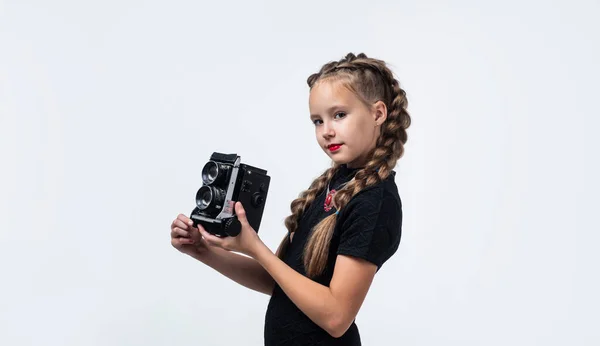 Pretty teen girl with pigtails hold vintage photo camera isolated on white, hobby — Foto de Stock