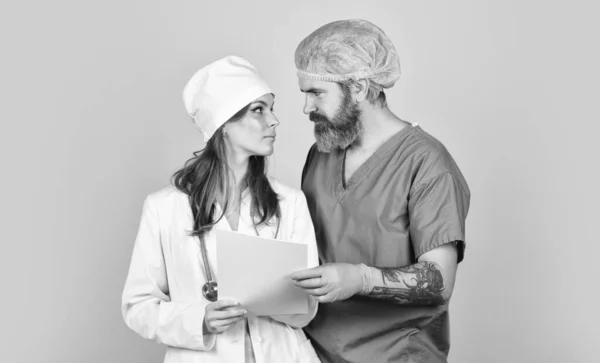 Diagnostics. Virus epidemic. Medical treatment. Surgeon assistant. Woman and man work at hospital. Private clinic. Medical workers. Health care. Surgery concept. Medical services. Nurse and doctor — Stock Photo, Image