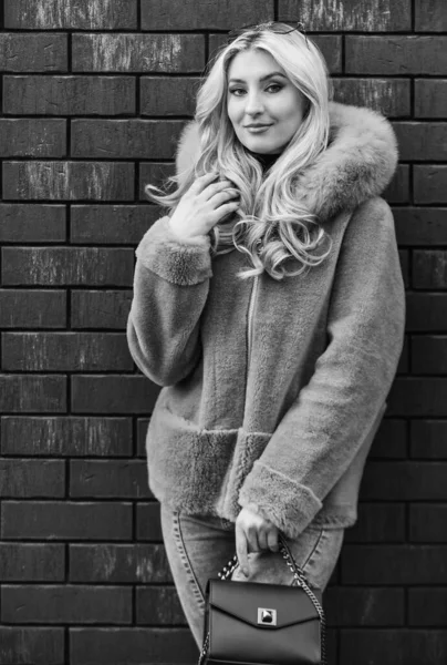 Glamorous lady. Woman wear furry coat. Winter clothes. Fashion as unique as you are. Pink sheepskin coat. Fancy chic coat. Natural wool sheepskin coat. Fur on hood. Stay warm and fashionable