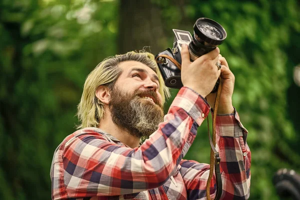 Hobby and professional occupation. Camera settings concept. Find perfect angle. Man with retro camera. Photography in modern life. Photographer use vintage camera. Bearded man hipster taking photo — Stock Photo, Image