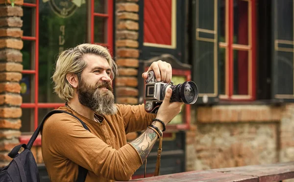 Modern business. Journalist reporter. Brutal stylish man with retro camera. Old technology. Professional photographer use vintage camera. Photography business. Bearded man hipster take photo — Stock Photo, Image
