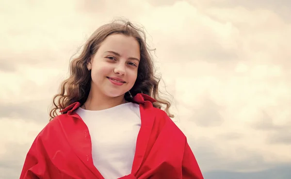 Teen girl with curly hair. hairdresser. Happy kid wear red jacket. Lifestyle and People Concept. kid spring and fall fashion. casual hipster look. copy space. childhood happiness — Stock Photo, Image