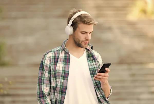 Busy man wireless headphones use smartphone, modern communication concept — Stock Photo, Image