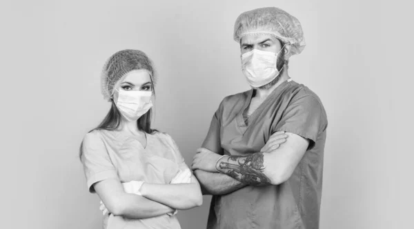 Qualified medicine staff. nurse and doctor wear respirator mask. surgeon after surgery operation. coronavirus epidemic from china. healthcare. Successful team of medical doctors — Stock Photo, Image
