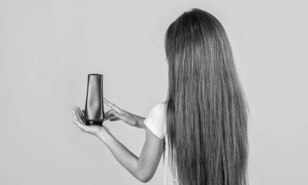 teen girl wash long straight hair with shampoo and condirioner, hairdresser