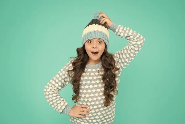 Pretty child girl with amazed face in knitted warm clothes, winter forecast — Stock Photo, Image