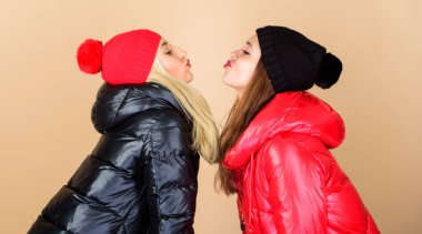 Winter kiss. Best friends matching outfits. Soulmates girls kiss. Women wear down jackets. Girls makeup face wear winter jackets. Fashion trend. Winter season. Glad to see you. Best friends forever clipart