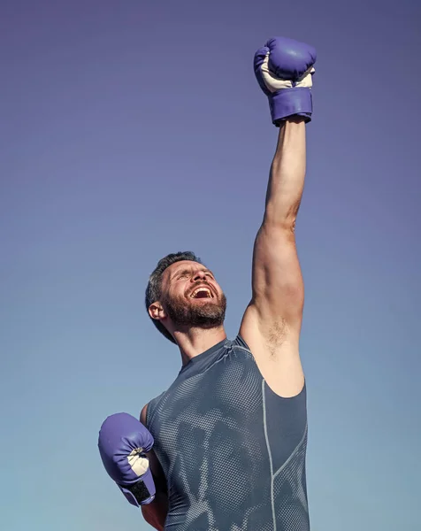 Man boxer on stadium. fitness gym outdoor. muscular athletic guy training in boxing gloves. sport success. male fitness sportswear. sportsman on sky background. mature handsome athlete — Stock Photo, Image