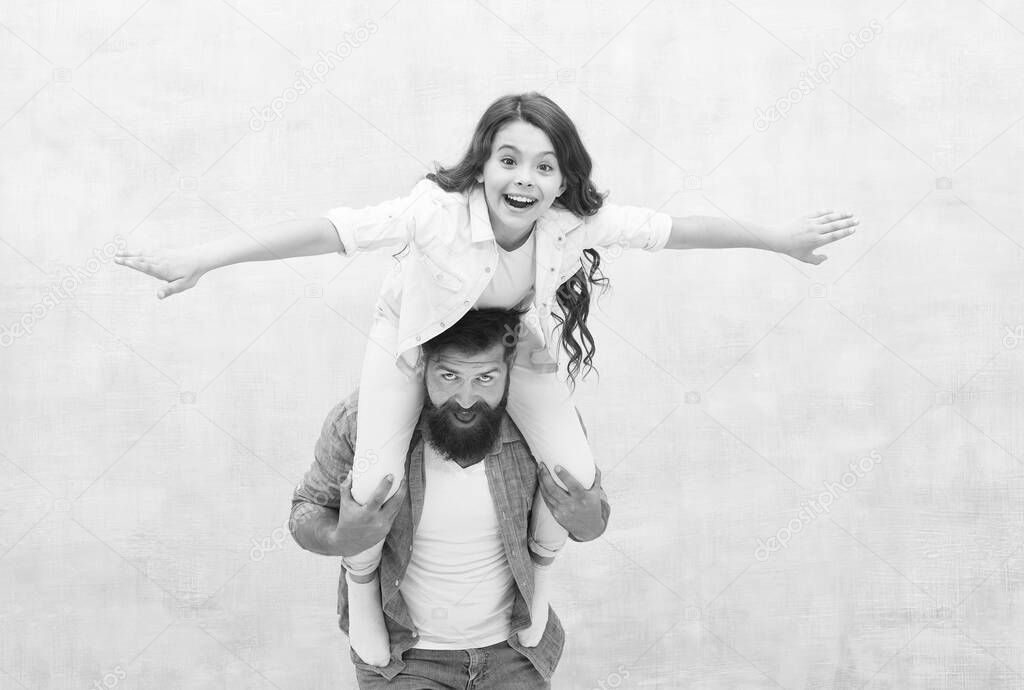 Flight of imagination. Father ride daughter child pretending flying. Happy family have fun together. Playing airplane. Childhood imagination. I believe I can fly