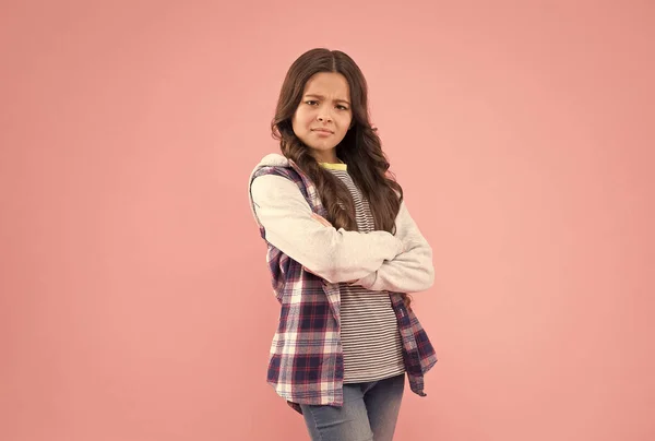 Confident kid with pouty look keep arms crossed in casual fashion style pink background, confidence — Stock Photo, Image