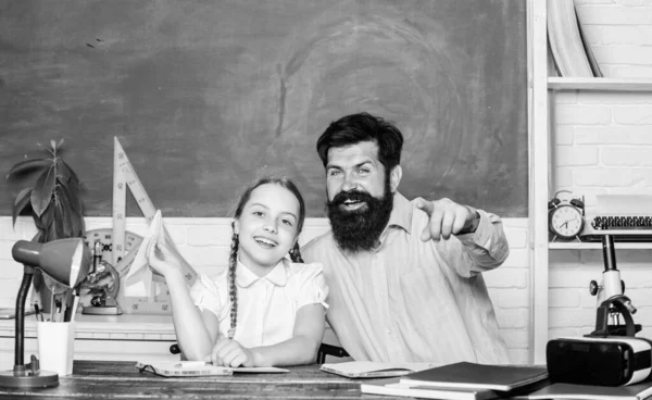 Inspired to work hard. private lesson. back to school. Private teaching. knowledge day. Home schooling. daughter study with father. Teachers day. girl child with bearded teacher man in classroom — Stock Photo, Image